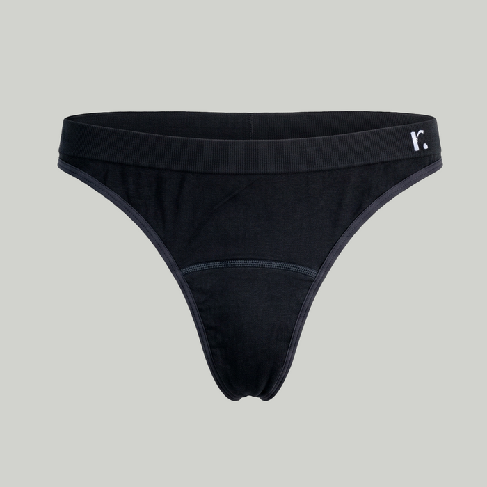 Front view of the black Rudie Period Thong on a plain pale background.